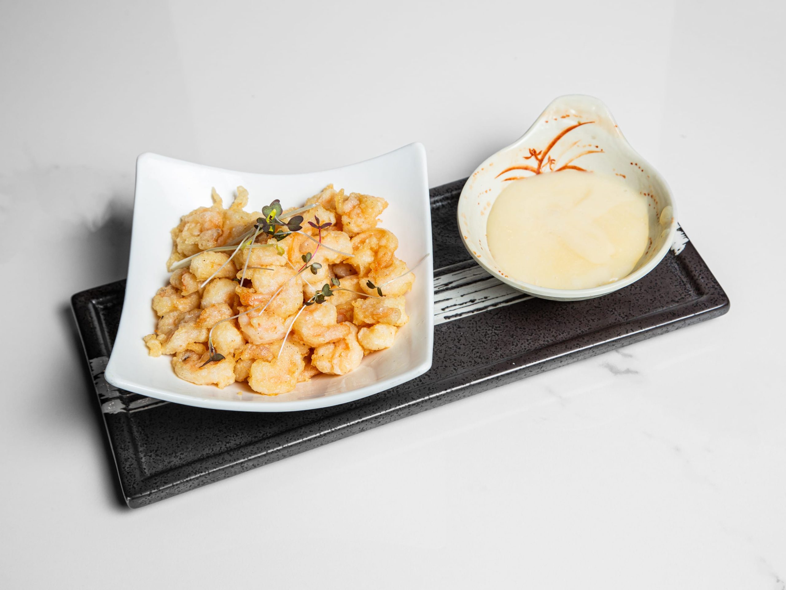 Crispy coconut-battered shrimp with sweet dipping sauce at Kuchi, a Buffet Restaurant in Tampa