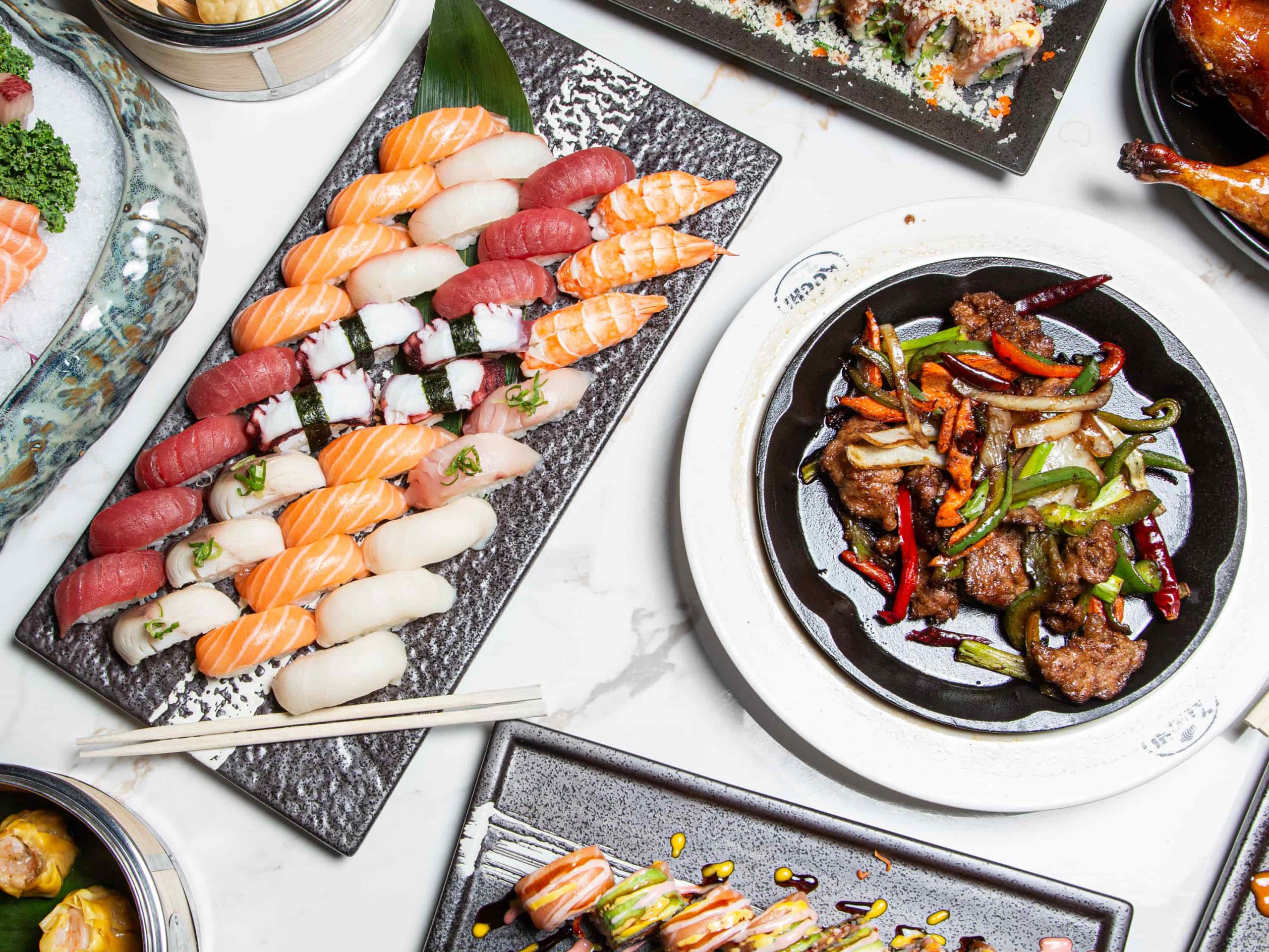 Assorted sushi and hot food platter at Kuchi, a Buffet Restaurant in Tampa