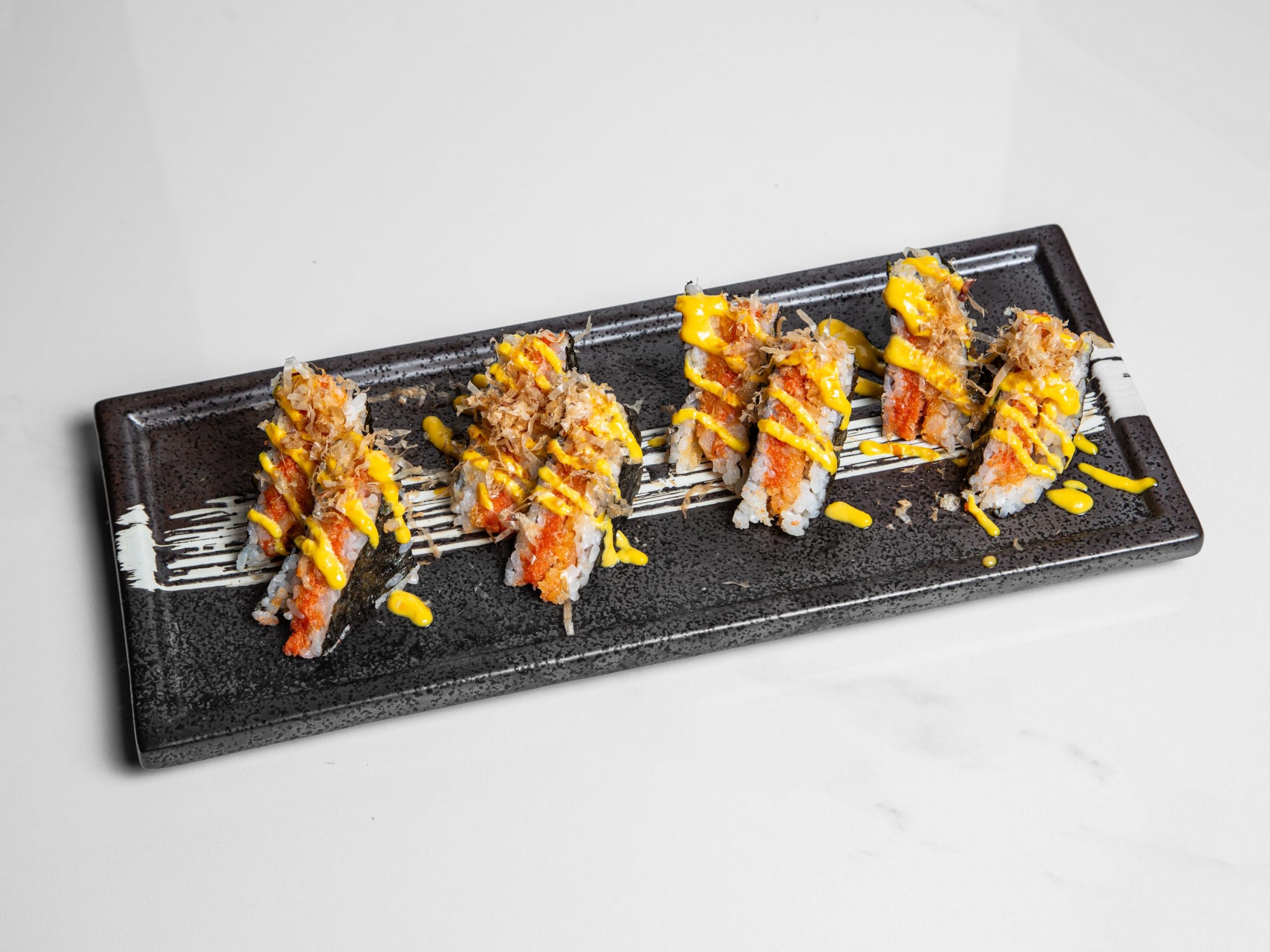 Sushi-style sandwich with rice, fish and avocado at Kuchi, a Buffet Restaurant in Tampa