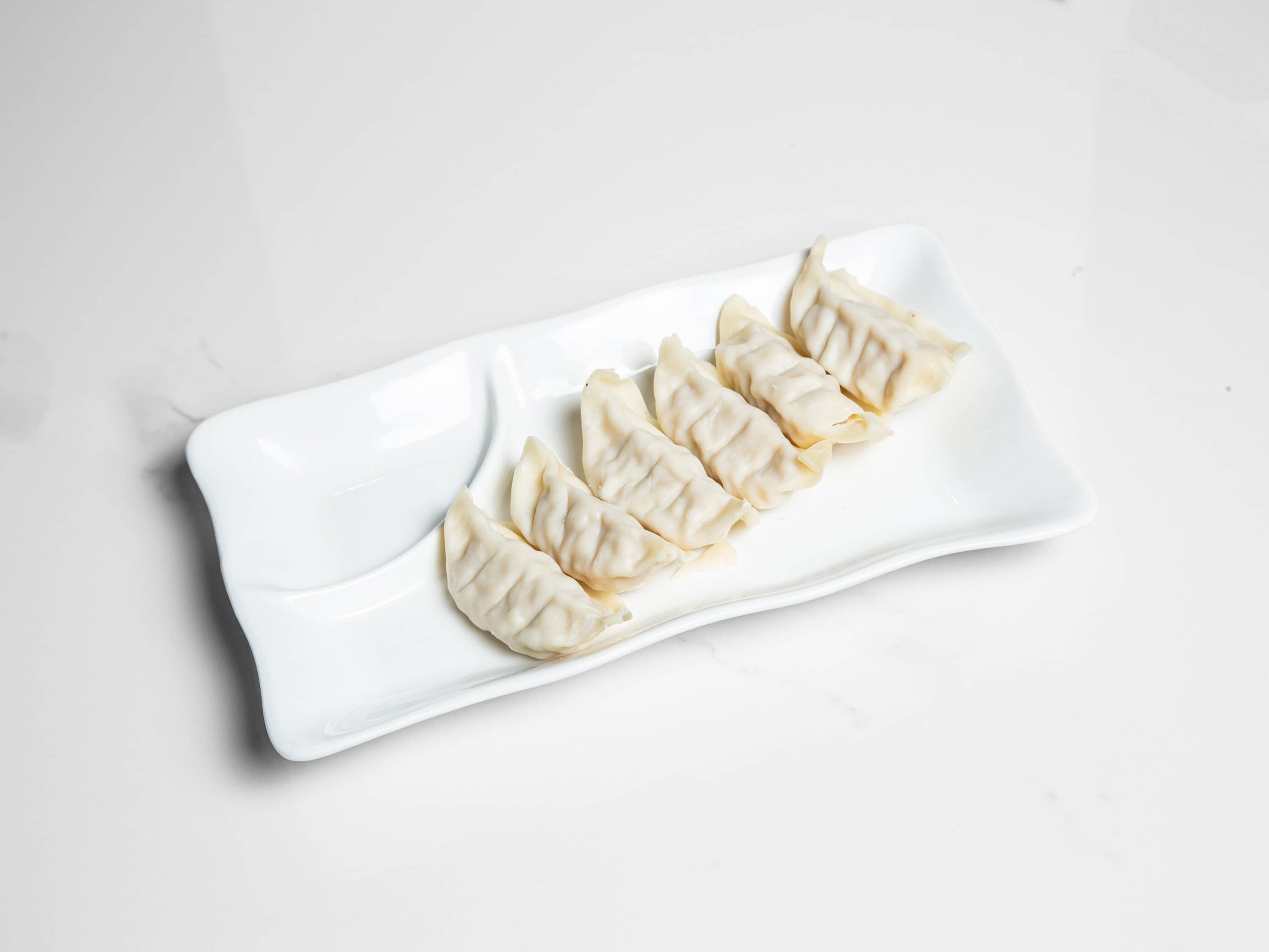 Steamed pork dumplings with savory filling at Kuchi, a Buffet Restaurant in Tampa