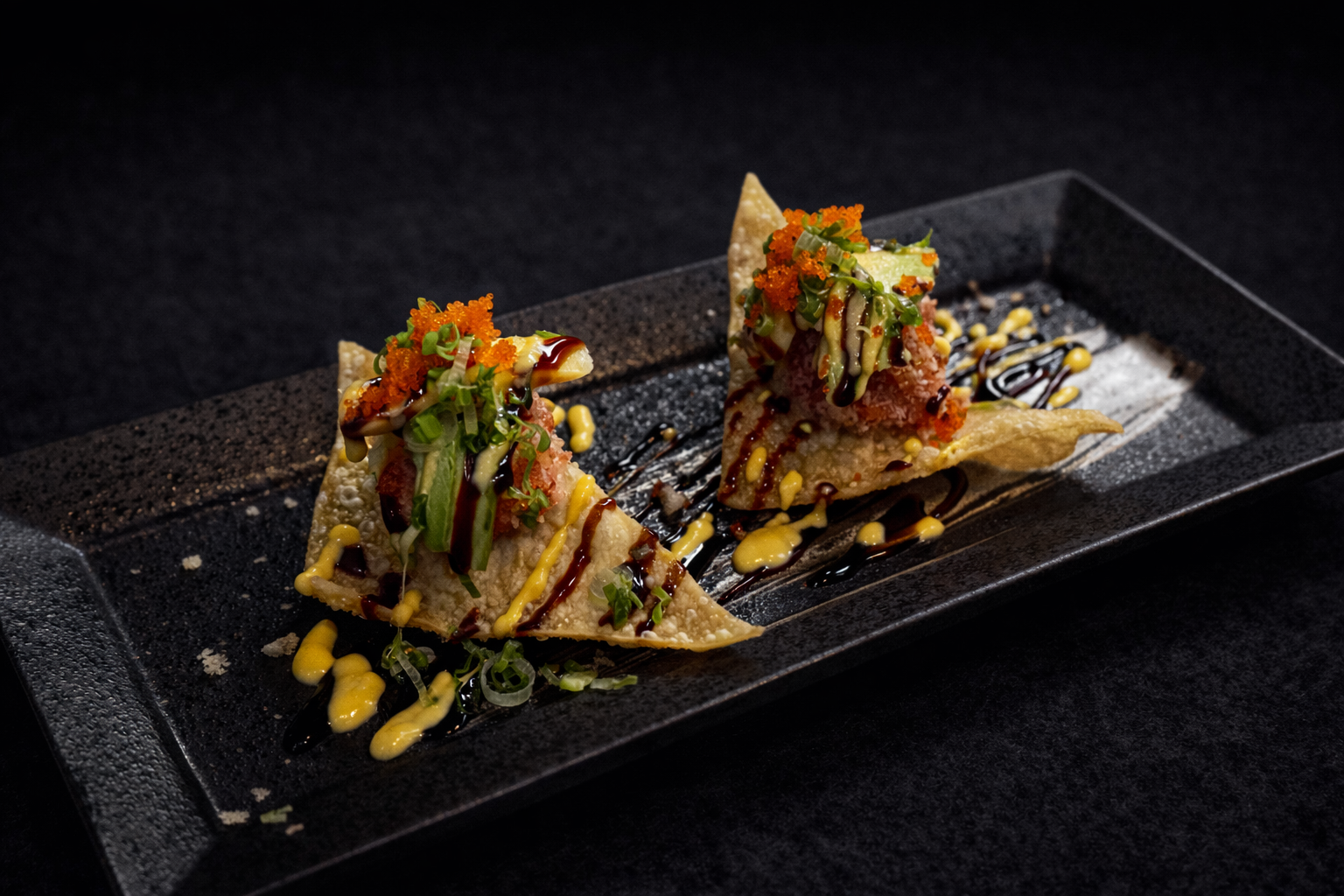 Tuna wonton tacos with avocado, roe, and sauces at Kuchi buffet, a Sushi restaurant in Tampa
