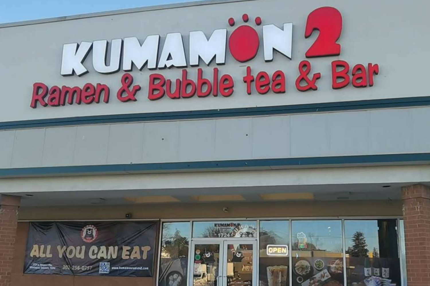 Restaurant storefront sign at Kumamon Sushi & Ramen AYCE, a Japanese Restaurant in Wilmington