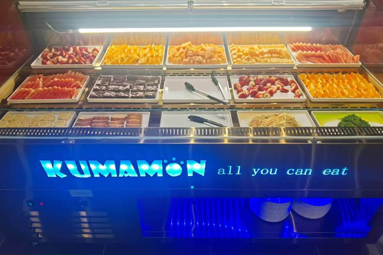 Self-serve dessert and fruit display case at Kumamon Sushi & Ramen AYCE, a Japanese Restaurant in Wilmington