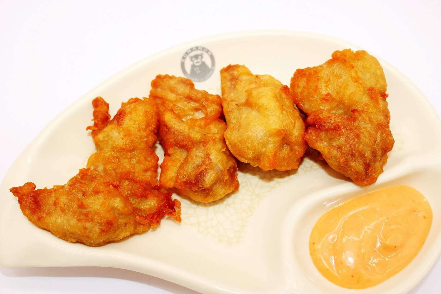 Crispy fried chicken pieces with creamy dip at Kumamon Sushi & Ramen AYCE, a Japanese Restaurant in Wilmington