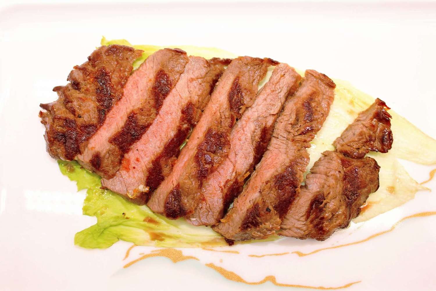 Sliced grilled beef steak with lettuce at Kumamon Sushi & Ramen AYCE, a Japanese Restaurant in Wilmington