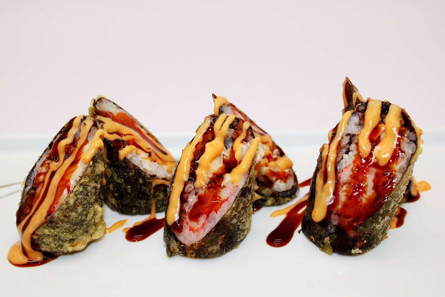 Crispy fried sushi rolls with spicy sauce at Kumamon Sushi & Ramen AYCE, a Japanese Restaurant in Wilmington