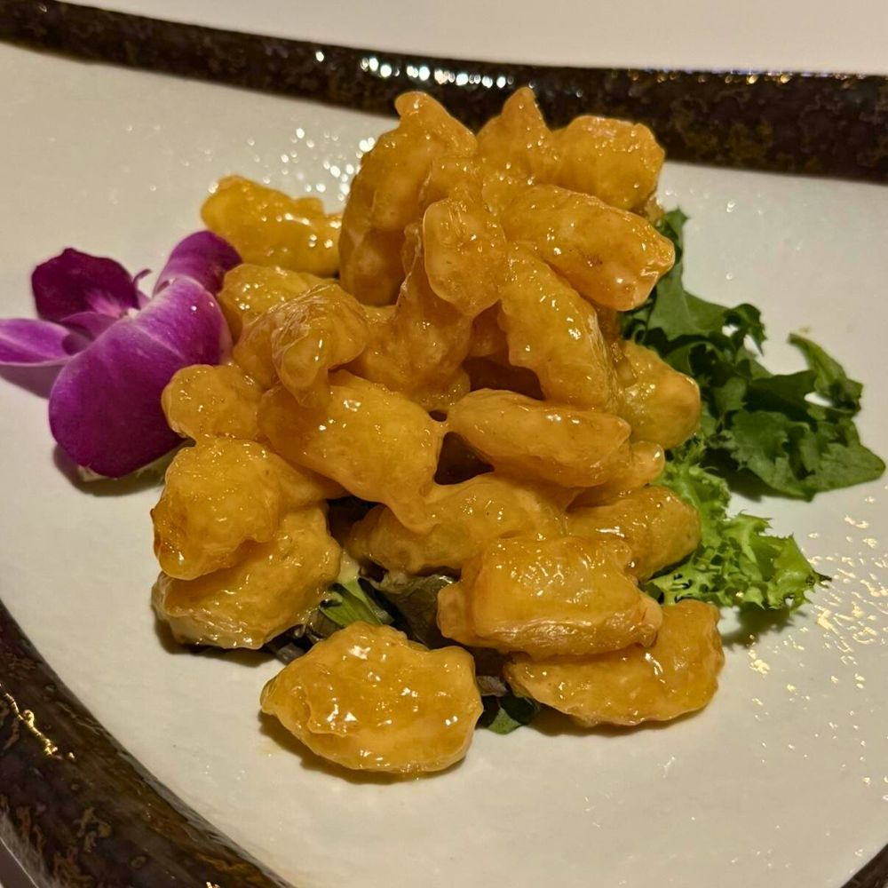 Crispy fried chicken bites with glossy coating at Kumo, a Japanese Restaurant in Schererville