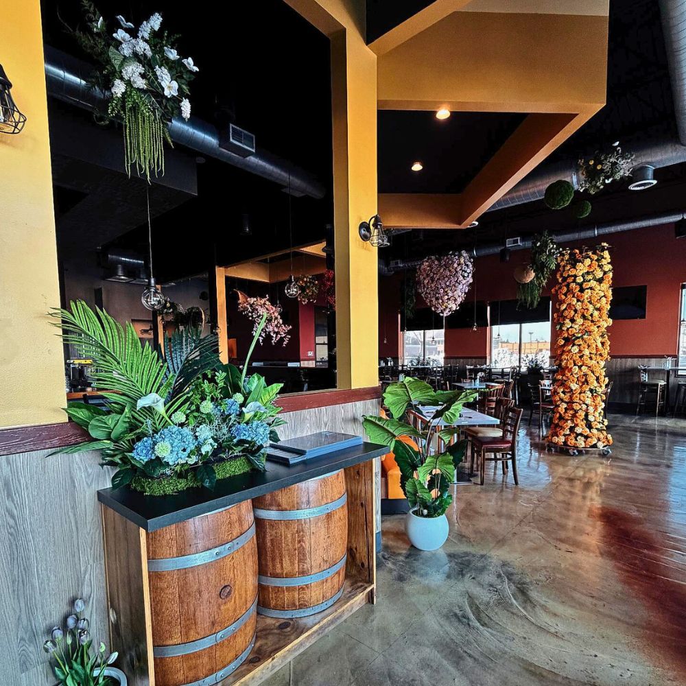 Entry with floral arrangements and barrel decor at Kumo, a Japanese Restaurant in Schererville