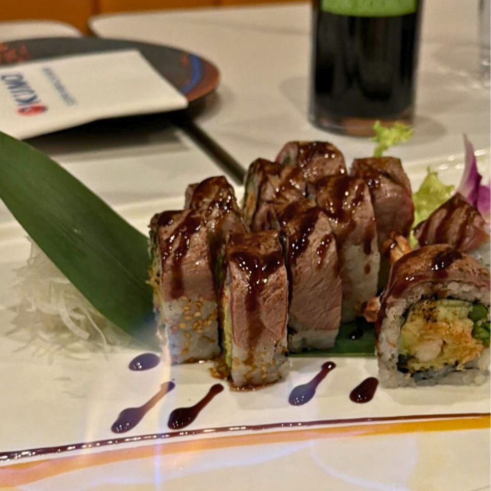 Tuna-topped sushi roll drizzled with sauce at Kumo, a Japanese Restaurant in Schererville