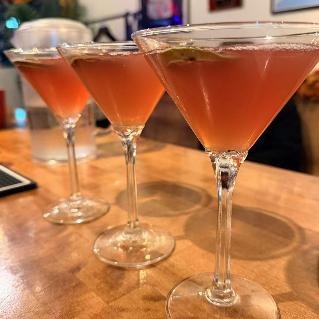 Pink cocktails in martini glasses at La Caridad 72, a Asian Restaurant in New York