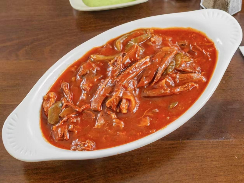 Spicy beef stir-fry in red sauce at La Caridad 72, a Asian Restaurant in New York