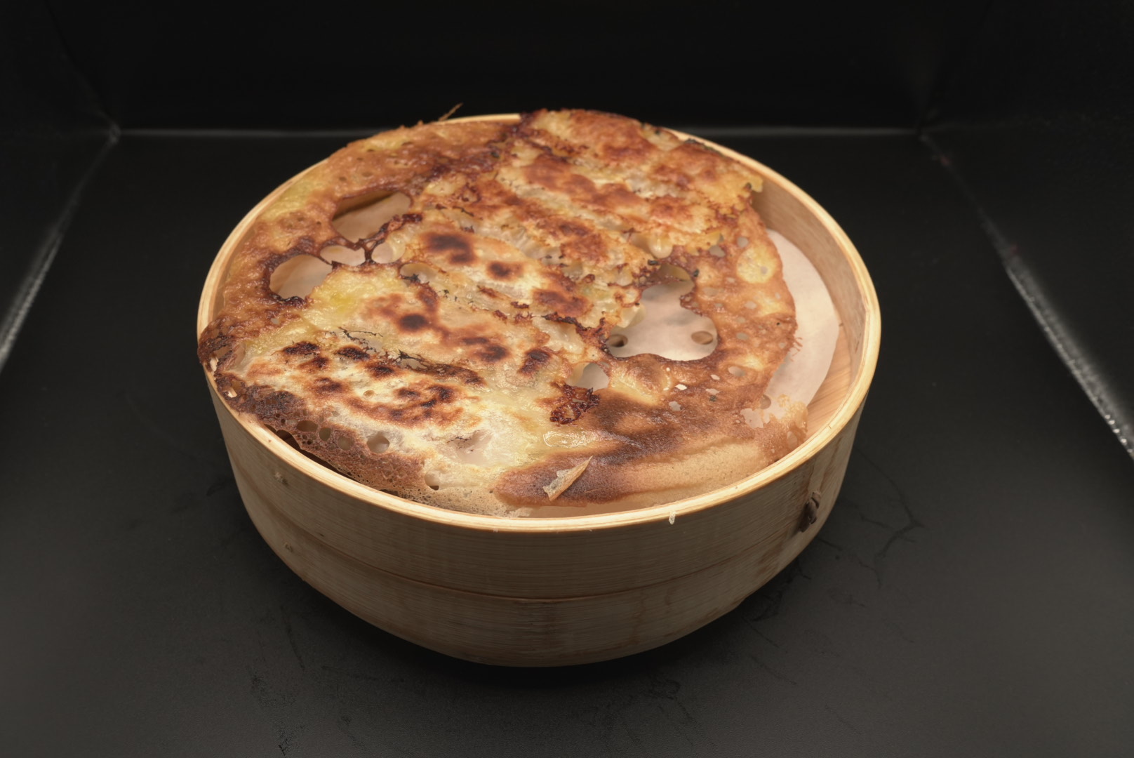 Crispy pancake in a bamboo steamer at Lao Hu Tong, a Asian Restaurant in Schaumburg