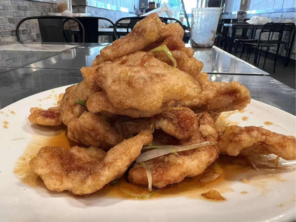 Liao-M-BBQ-Chinese-restaurant-Fried-Pork-Cutlets-Flushing Fried Pork Cutlets - Crispy fried pork cutlets with a savory sauce at Liao M BBQ, a Chinese restaurant in Flushing
