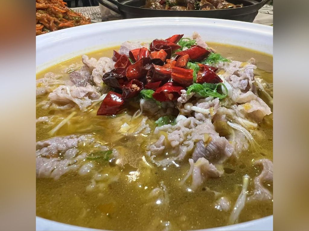 Liao-M-BBQ-Chinese-restaurant-Sour-Soup-Sliced-Mutton-Flushing Sour Soup Sliced Mutton - Sliced mutton in a sour soup base topped with dried chili at Liao M BBQ, a Chinese restaurant in Flushing