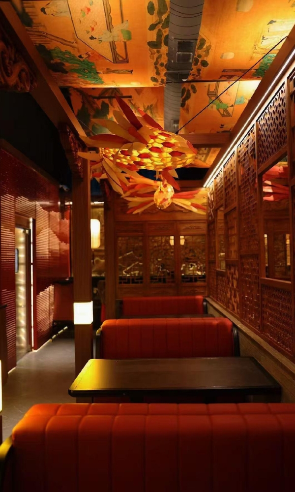 Dining area with fish-shaped lantern and mural ceiling at Ling Long, a Asian Restaurant in Oklahoma City