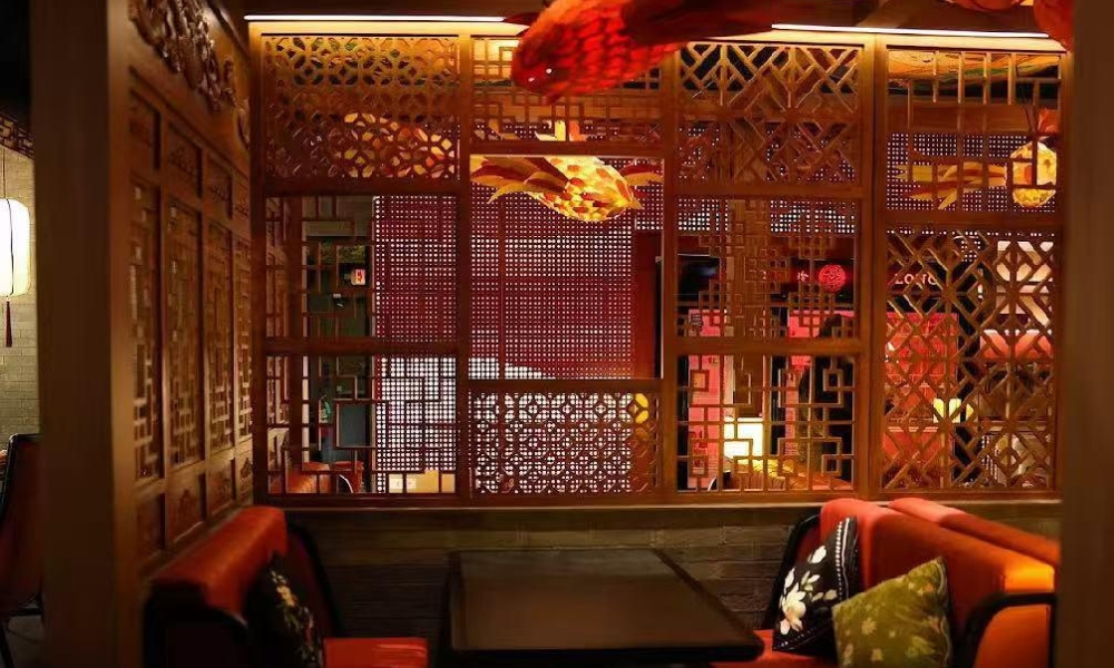 Dining booth with wooden partition and fish lantern at Ling Long, a Asian Restaurant in Oklahoma City