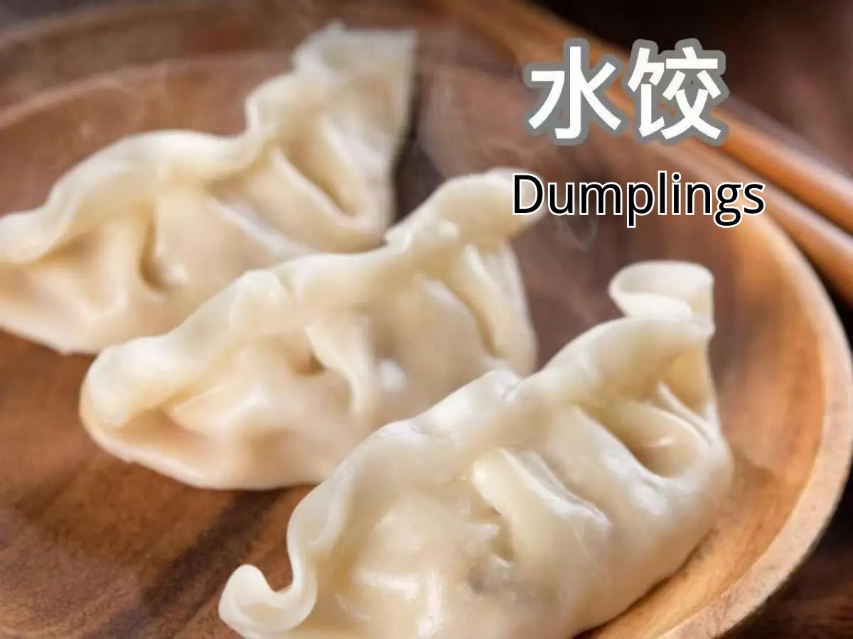 Yums-Chinese-Restaurant-Dumpling-Memphis Steamed dumplings on a wooden plate at Yums, a Chinese Restaurant in Memphis.