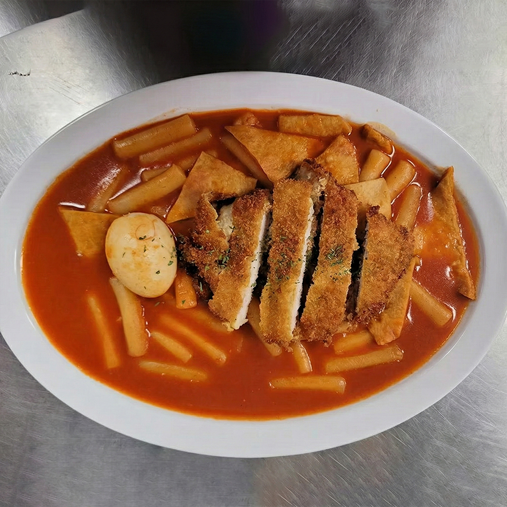 Kimchi fried rice with pork cutlet served at Lotte Bunsik, a casual Korean eatery in Edison.