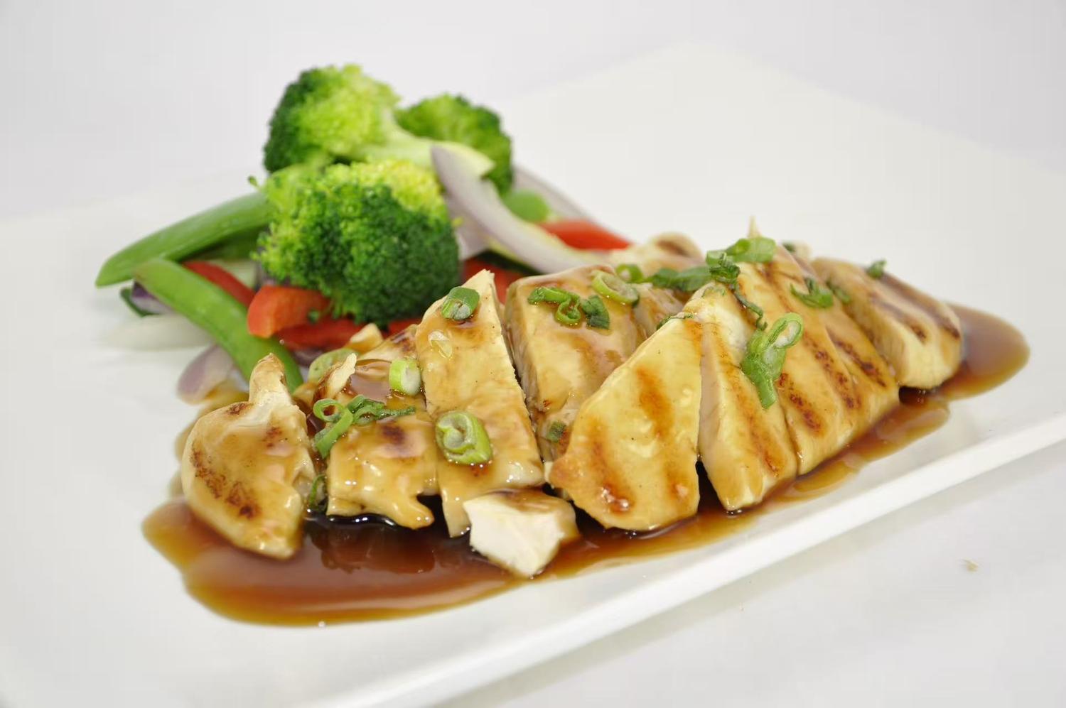 Grilled chicken breast with assorted fresh vegetables.