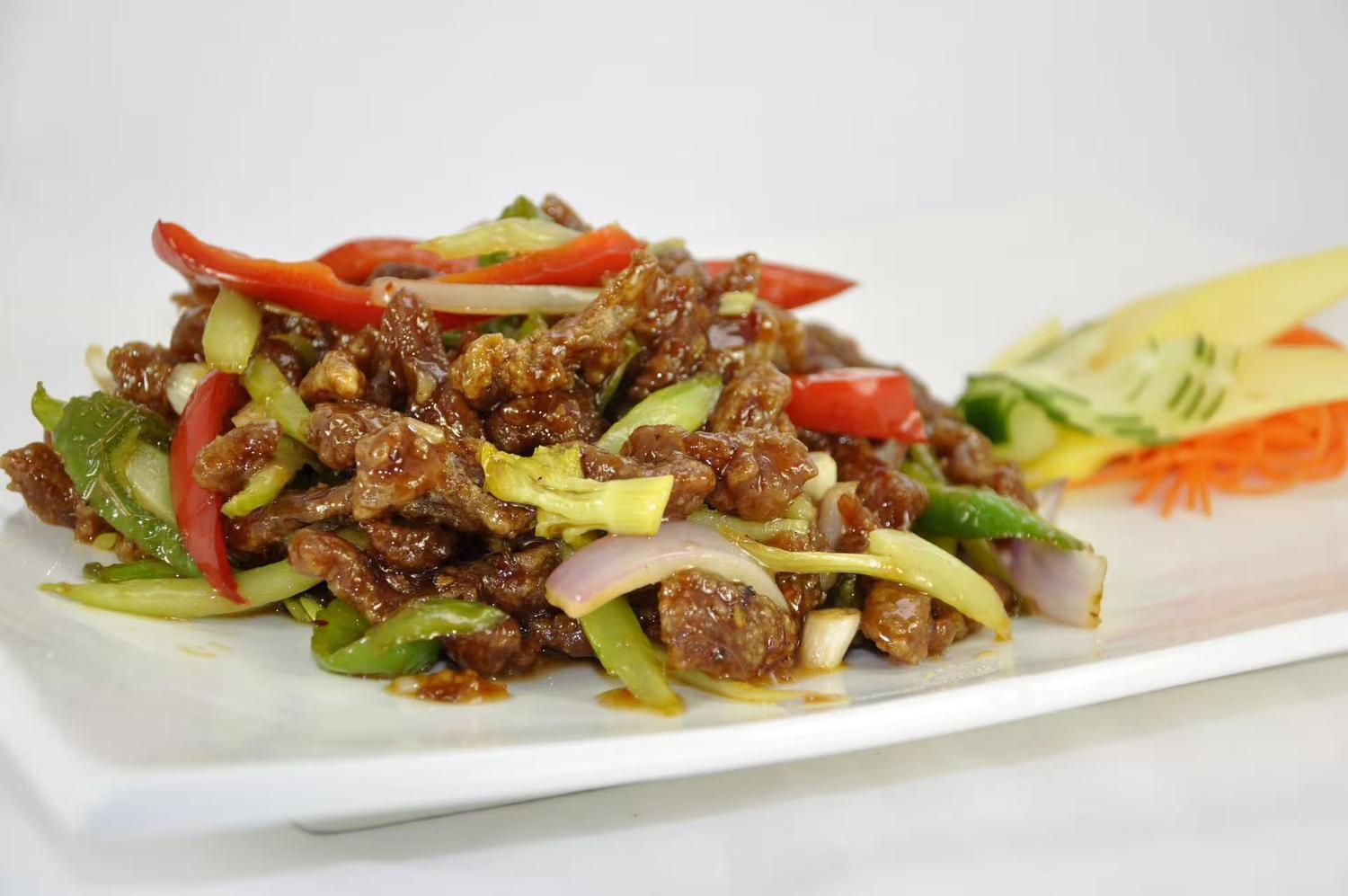 Tender beef stir - fried with fresh colorful vegetables.