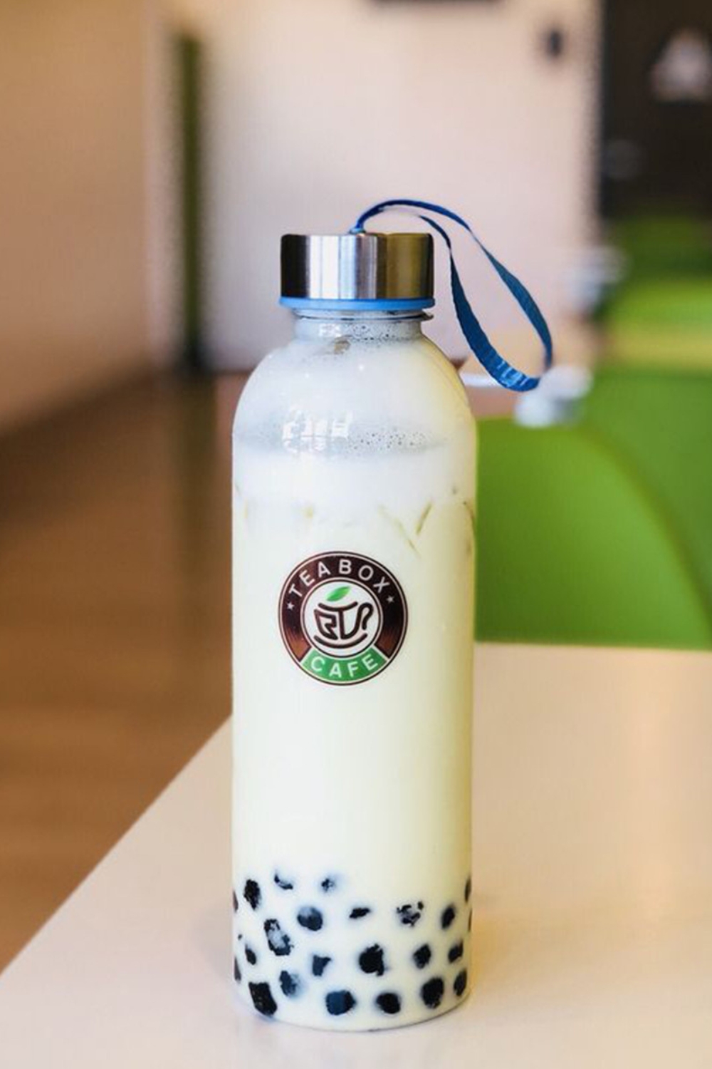 White creamy milk tea packed in portable glass bottle at Tea Box Cafe, a Bubble Tea Store in Lancaster