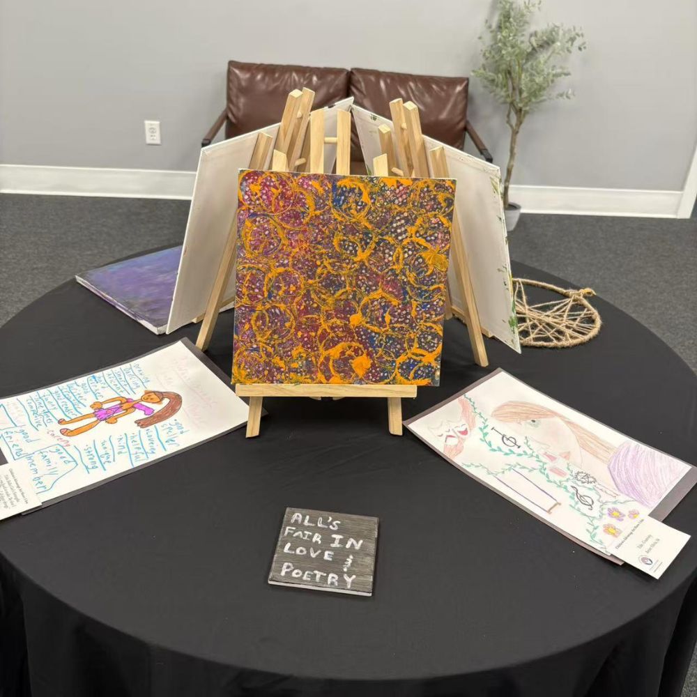 Handmade paintings and poetry artworks displayed on round table at LuCha Bubble Tea & Cafe, Bubble Tea Store in OH Handmade paintings and poetry artworks displayed on round table at LuCha Bubble Tea & Cafe, Bubble Tea Store in OH