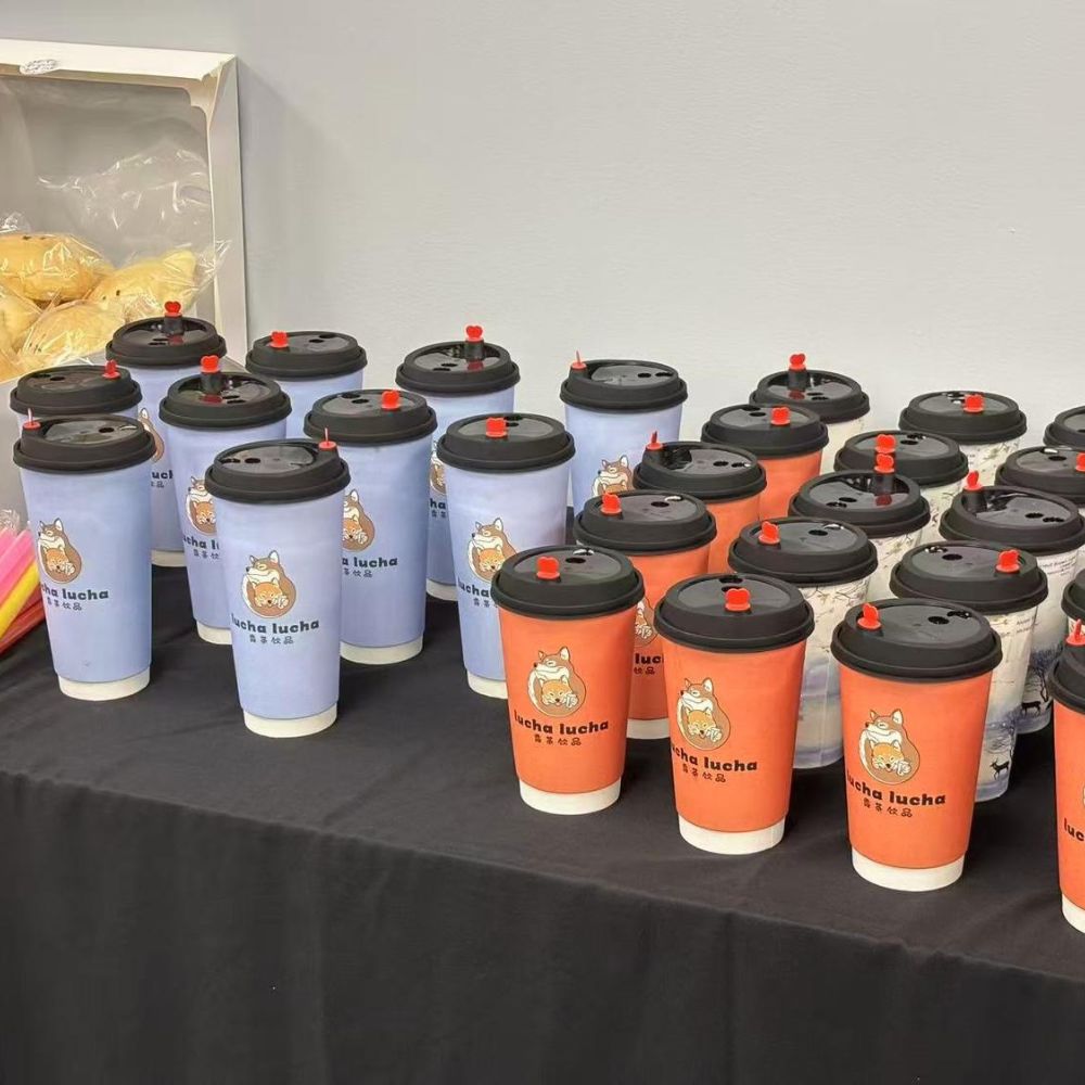 Various colorful LuCha branded milk tea cups arranged neatly at LuCha Bubble Tea & Cafe, Bubble Tea Store in OH Various colorful LuCha branded milk tea cups arranged neatly at LuCha Bubble Tea & Cafe, Bubble Tea Store in OH