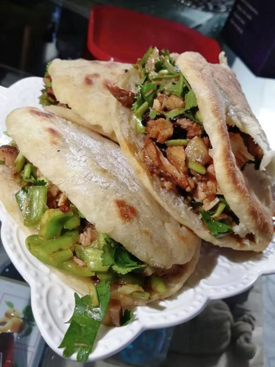 Roujiamo with meat and vegetables inside at Tao's Bao，a Chinese Restaurant in Stony Brook