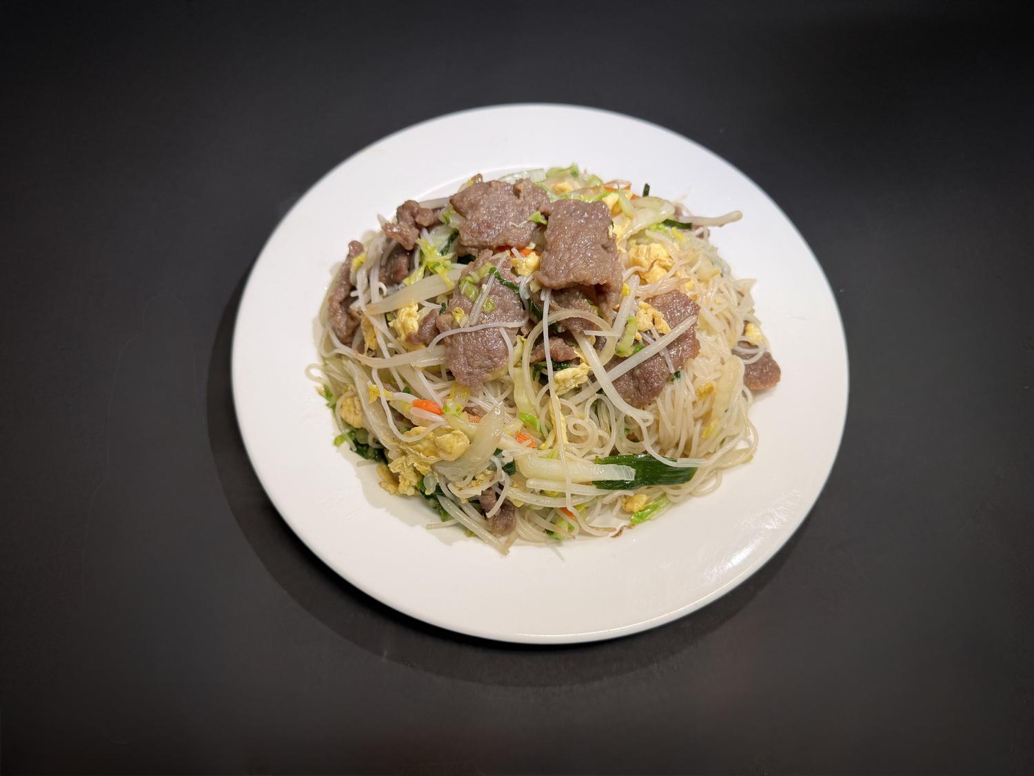 Beef rice noodles stir‑fried with egg, cabbage and fresh vegetables at Lucky House, a Chinese restaurant in Surprise