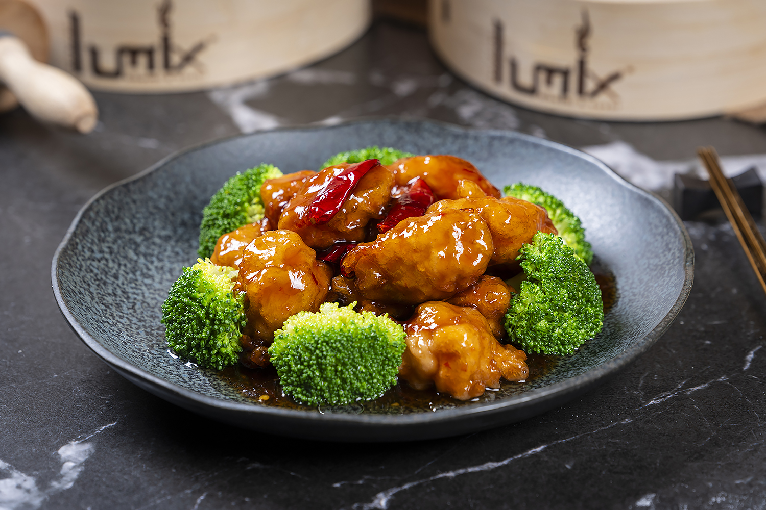 Sweet and sour chicken with broccoli served on a plate