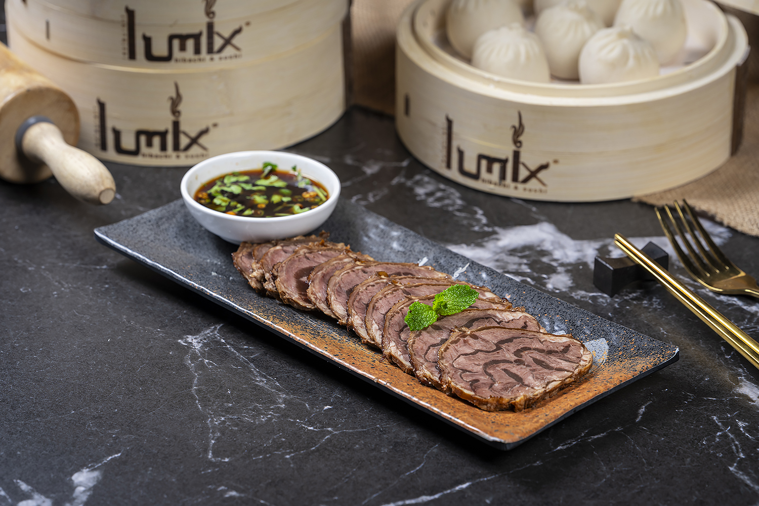 Sliced beef appetizer served with dipping sauce