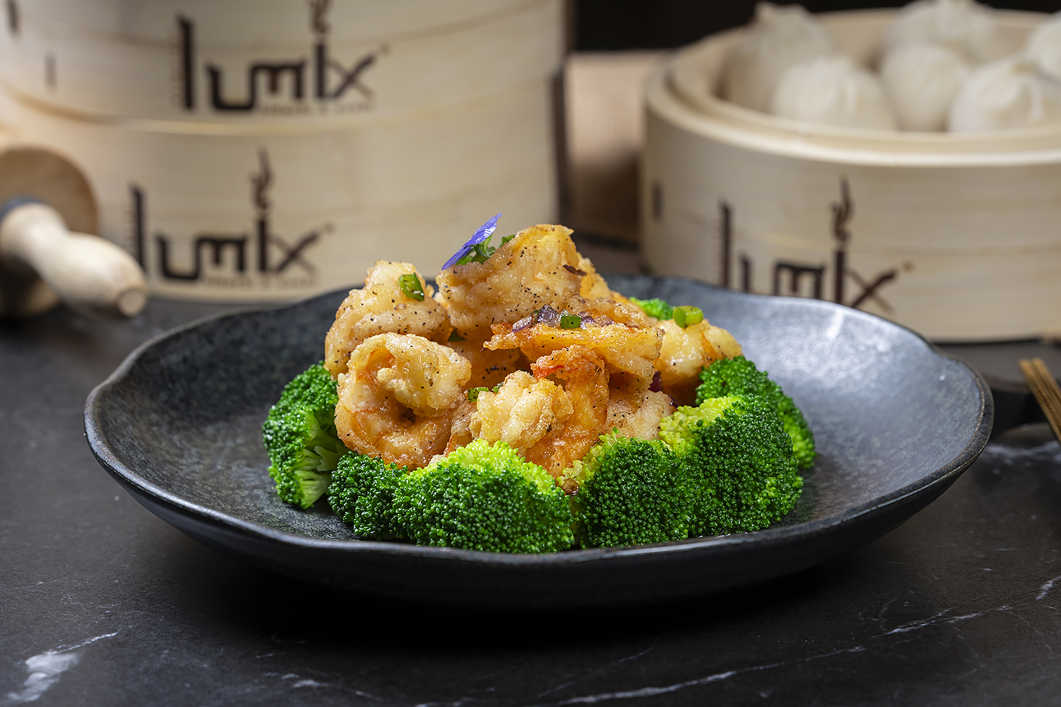 Crispy shrimp with broccoli served as an Asian entrée