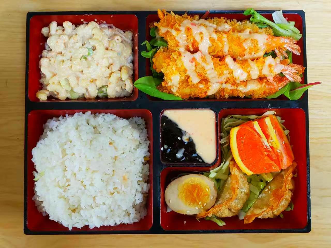 Tempura shrimp bento box with rice, macaroni salad and dumplings at Luv Ramen & BBQ, a Japanese restaurant in Hawthorne