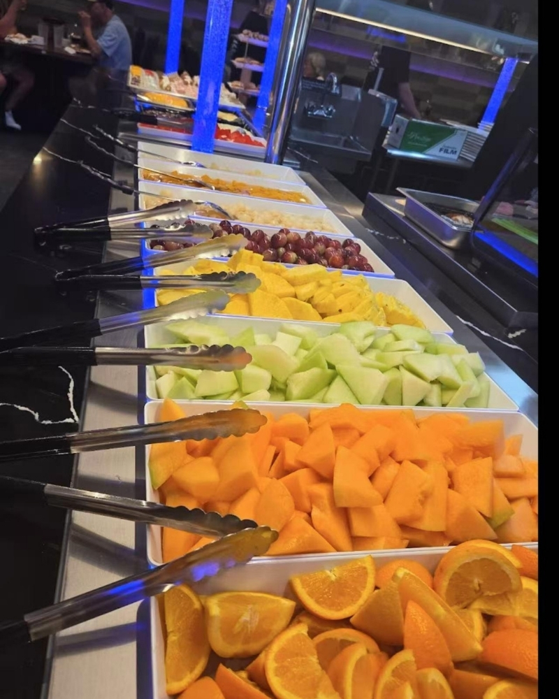 Fresh fruit platter with assorted melons and citrus at Madness Buffet, a Buffet Restaurant in Pompano Beach