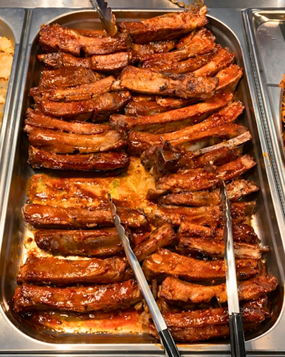 Glazed barbecued pork ribs at Madness Buffet, a Buffet Restaurant in Pompano Beach