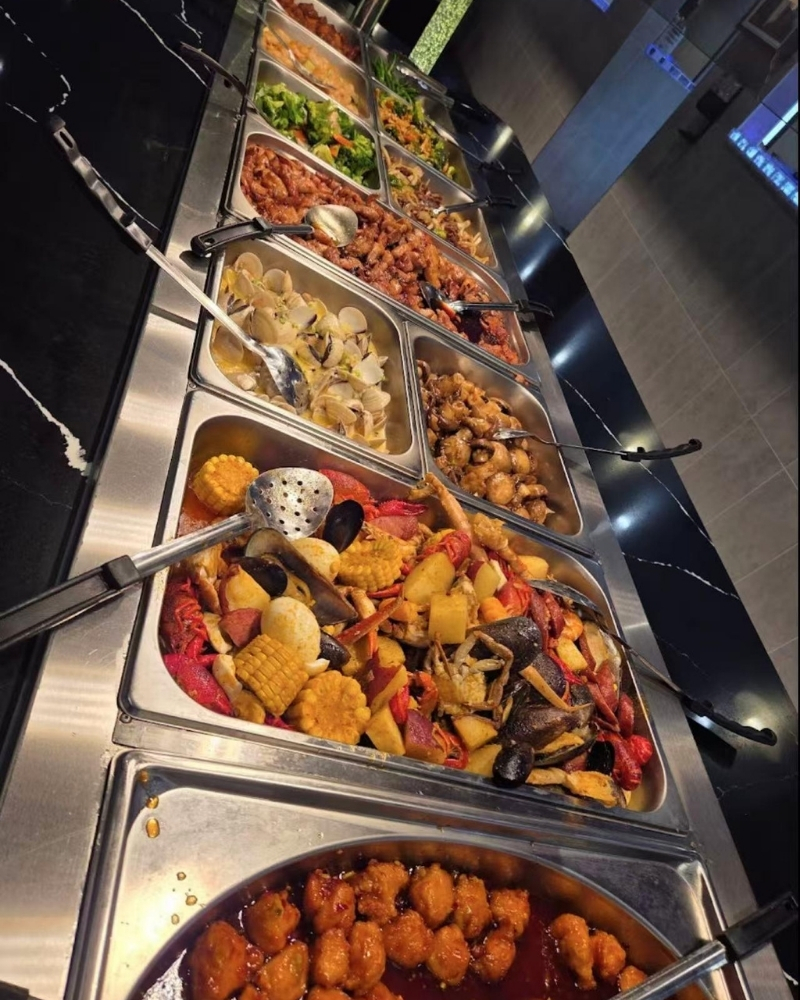Seafood boil and assorted hot dishes at Madness Buffet, a Buffet Restaurant in Pompano Beach