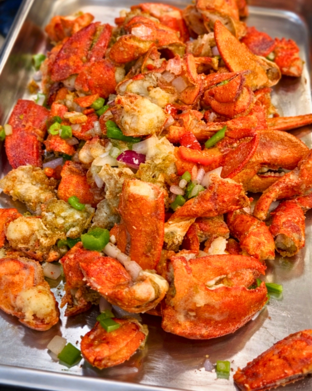 Spicy stir-fried lobster claws with vegetables at Madness Buffet, a Buffet Restaurant in Pompano Beach