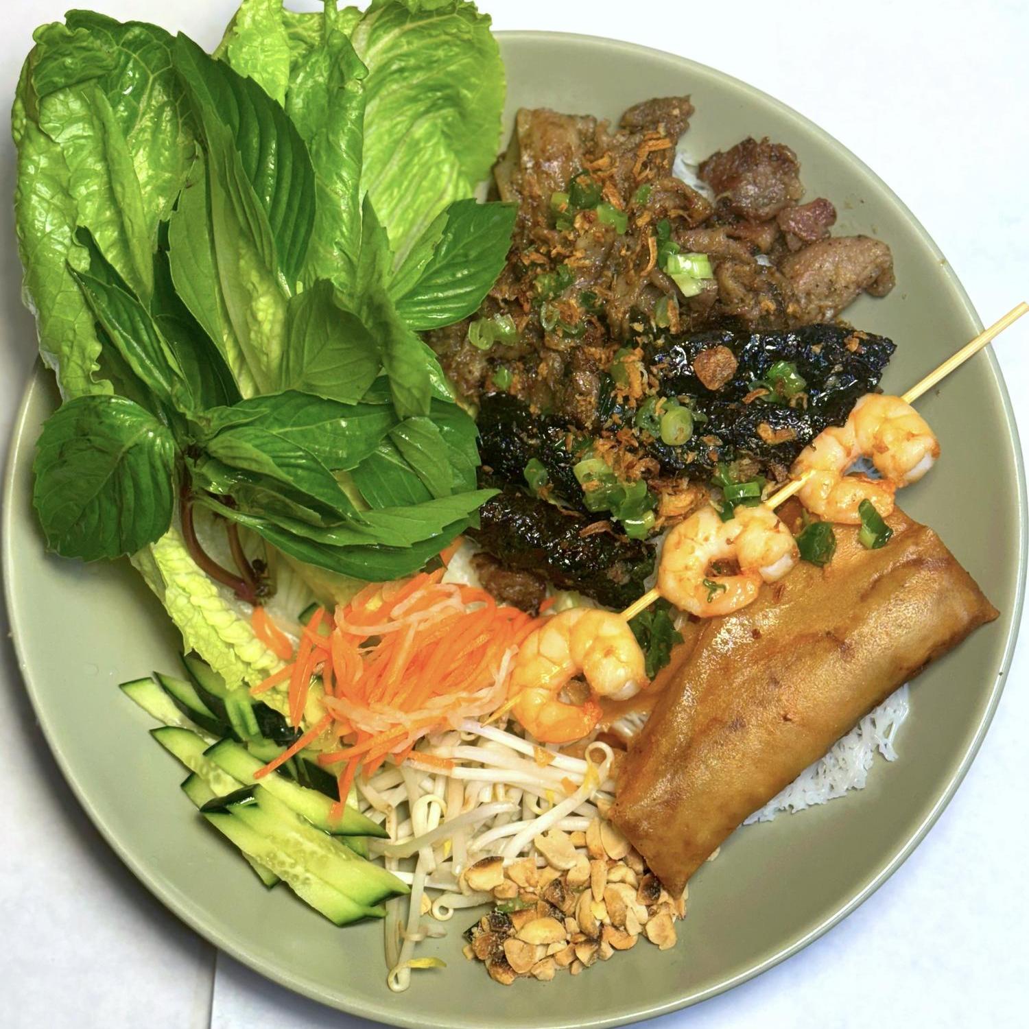 Magnolia-Pho-Vietnamese-Restaurant-Assorted-Vermicelli-Platter-with-Shrimp-Skewer-Seattle Assorted vermicelli platter with shrimp skewer and egg roll at Magnolia Pho, a Vietnamese Restaurant in Seattle