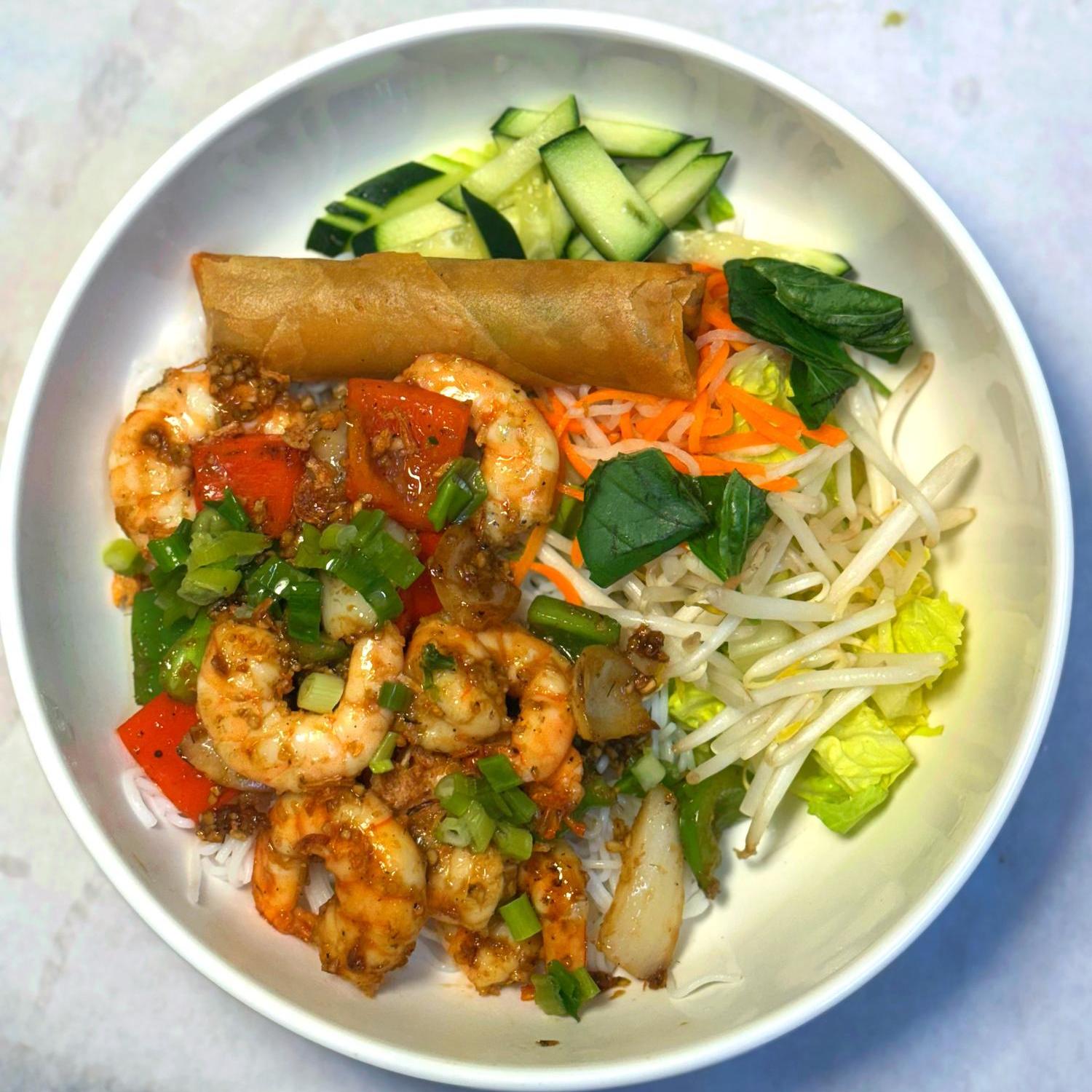 Magnolia-Pho-Vietnamese-Restaurant-Spicy-Shrimp-Vermicelli-Bowl-with-Egg-Roll-Seattle Spicy shrimp vermicelli bowl with egg roll and crisp veggies at Magnolia Pho, a Vietnamese Restaurant in Seattle