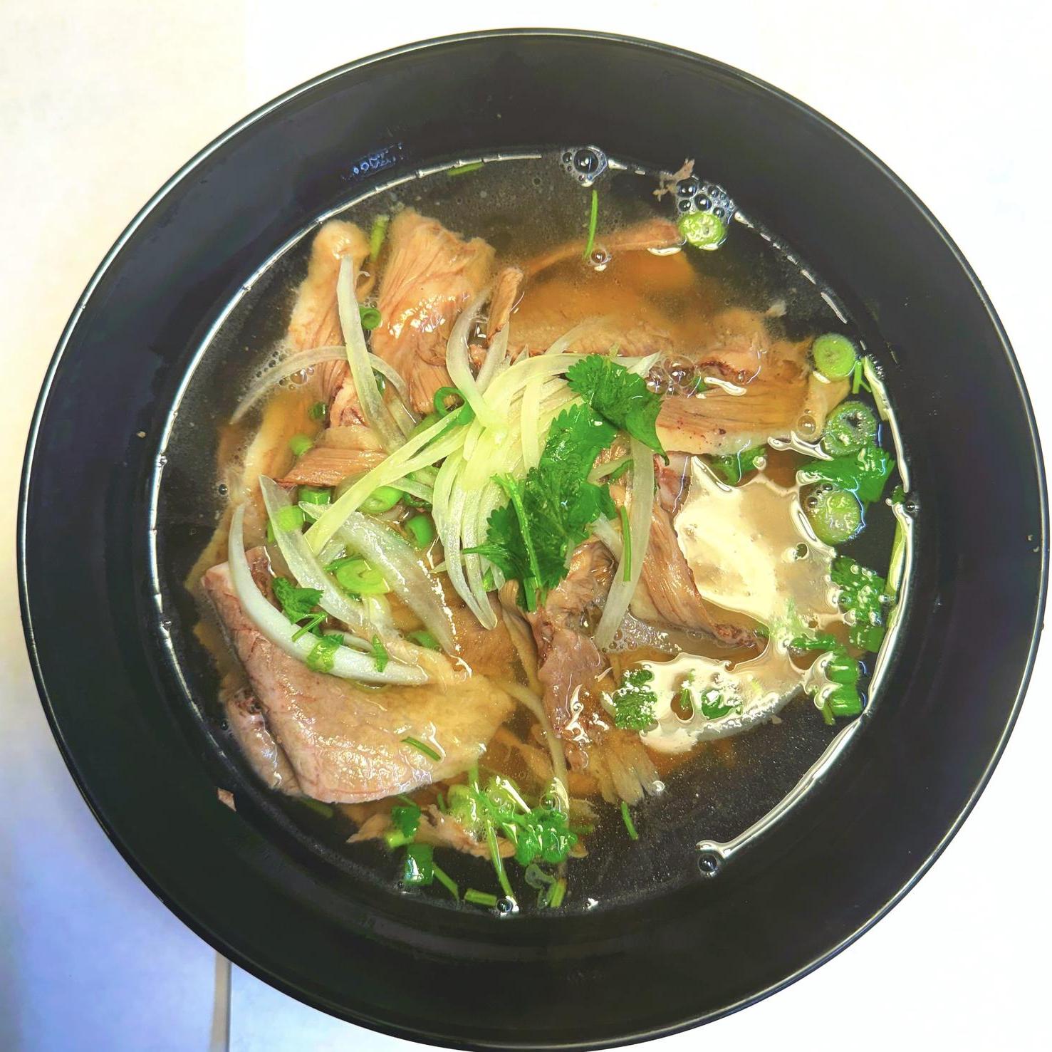 Magnolia-Pho-Vietnamese-Restaurant-Beef-Pho-Seattle Aromatic beef pho with tender beef and herbs at Magnolia Pho, a Vietnamese Restaurant in Seattle