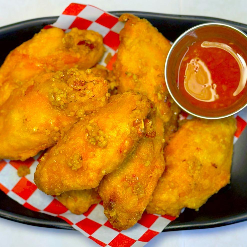Magnolia-Pho-Vietnamese-Restaurant-Crispy-Chicken-Wings-with-Dipping-Sauce-Seattle Crispy chicken wings served with tangy dipping sauce at Magnolia Pho, a Vietnamese Restaurant in Seattle