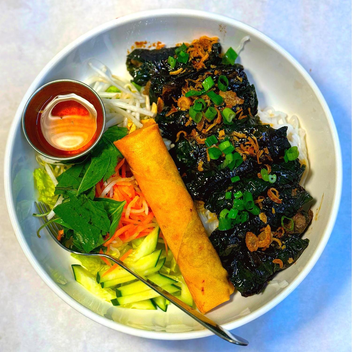 Magnolia-Pho-Vietnamese-Restaurant-Vietnamese-Bowl-with-Egg-Roll-and-Sauce-Seattle Vietnamese bowl with egg roll, veggies and dipping sauce at Magnolia Pho, a Vietnamese Restaurant in Seattle