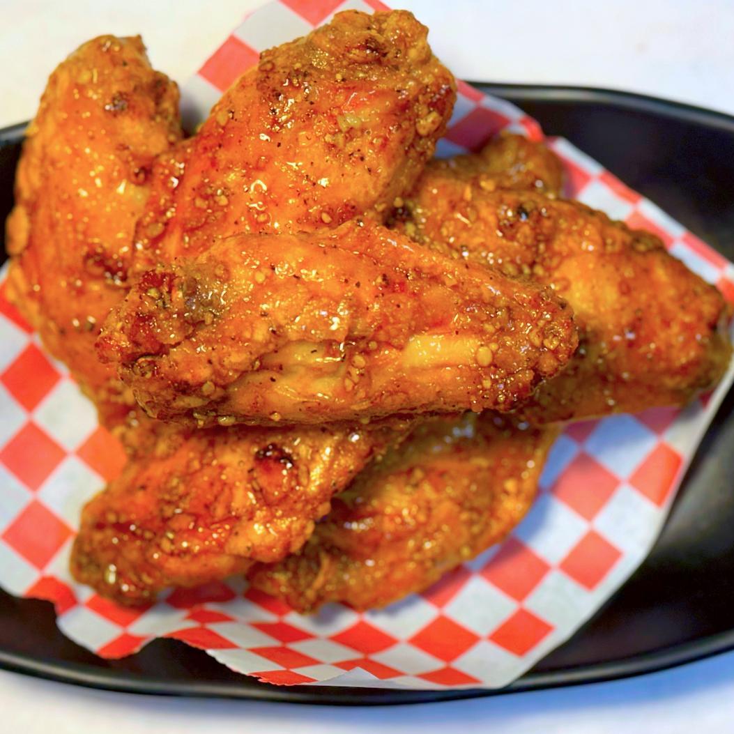 Magnolia-Pho-Vietnamese-Restaurant-Spicy-Glazed-Chicken-Wings-Seattle Spicy glazed chicken wings with rich seasoning at Magnolia Pho, a Vietnamese Restaurant in Seattle
