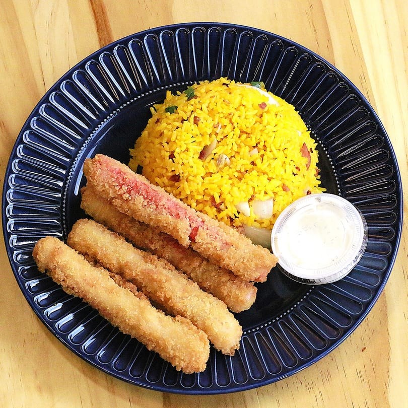 Fried crab sticks and yellow fried rice with dipping sauce at Main Garden, a Chinese Fusion Restaurant in Passaic