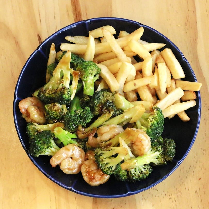Shrimp with broccoli and French fries in a blue bowl at Main Garden, a Chinese Fusion Restaurant in Passaic