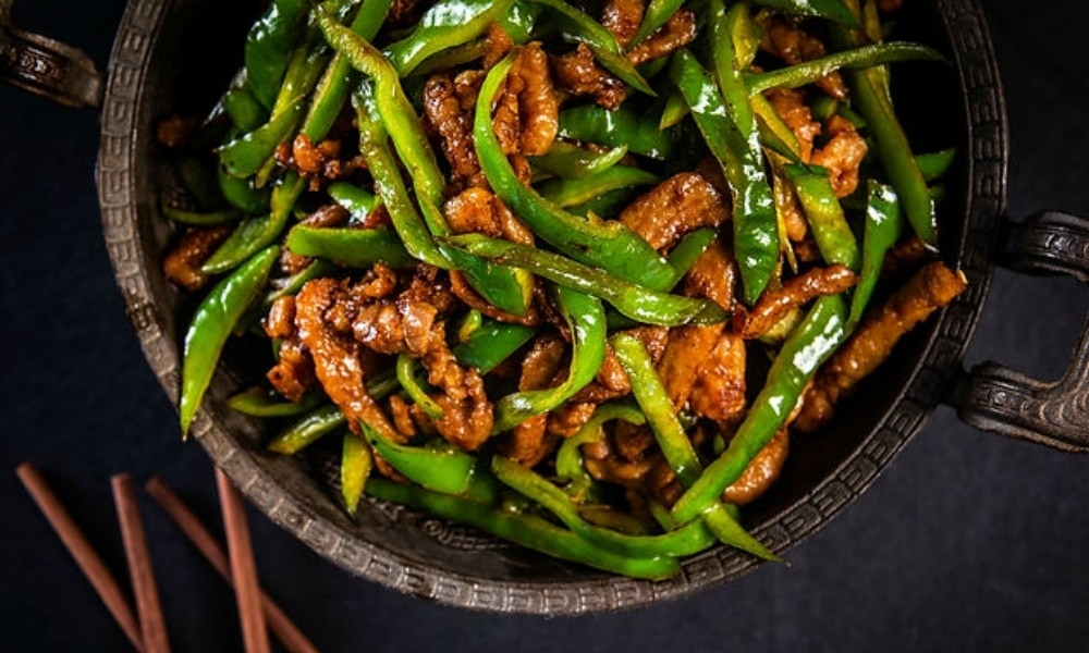 Appetizing stir-fried green pepper shredded pork at Mama Chang, a Chinese Restaurant in Colmar