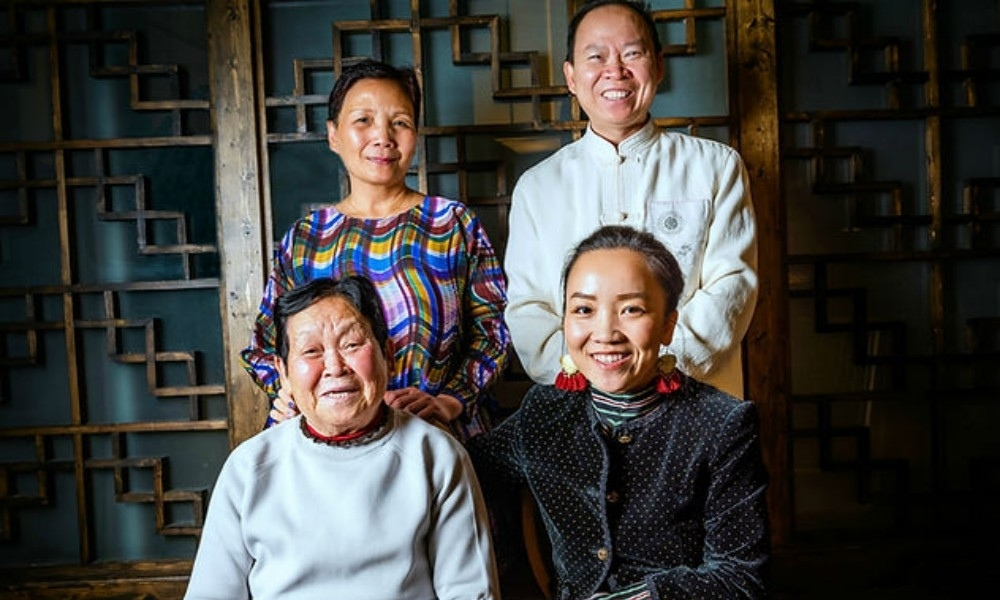 Four generations of a Chinese family take warm group portraits at Mama Chang, a Chinese Restaurant in Colmar