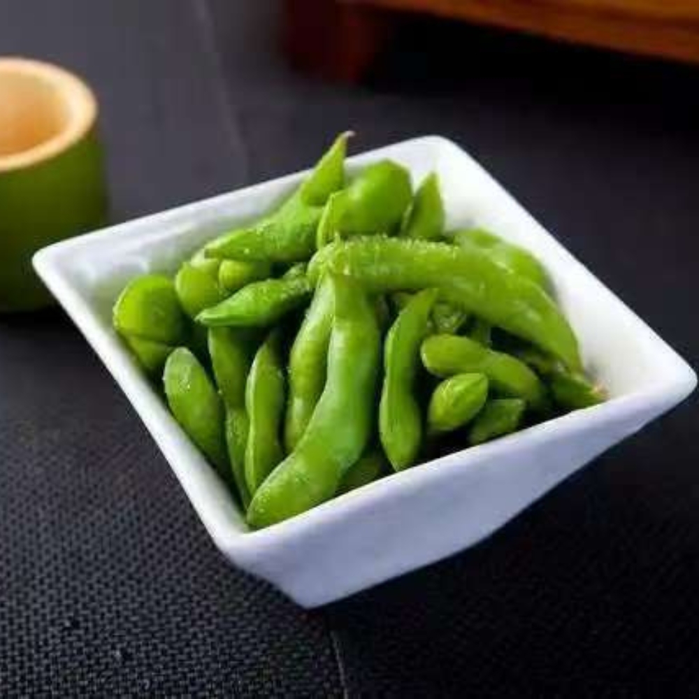 Mama-Hong’s-Pho-&-Bistro-Vietnamese-Restaurant-Edamame-Mustang A serving of boiled edamame in a square dish at Mama Hong's Pho & Bistro, a Vietnamese Restaurant in Mustang.