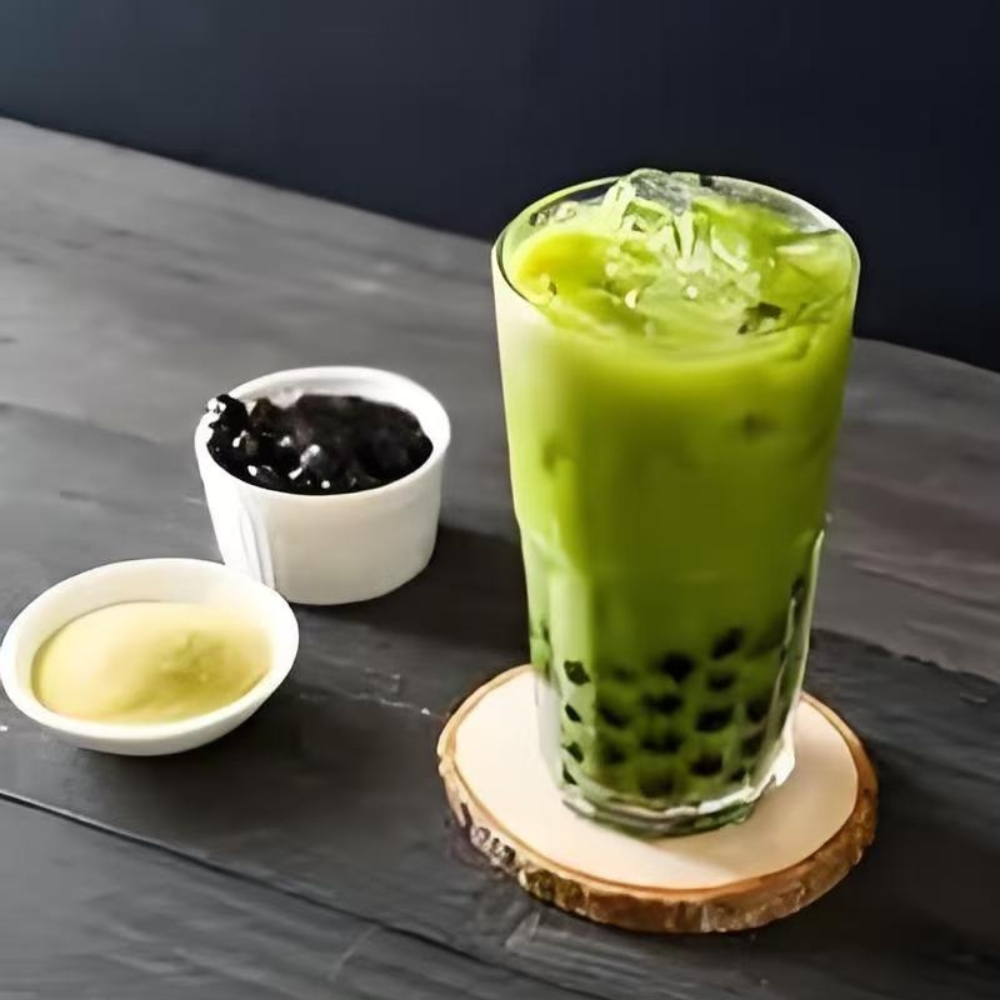 Mama-Hong’s-Pho-&-Bistro-Vietnamese-Restaurant-Matcha-Bubble-Tea-Mustang A tall glass of matcha bubble tea with ice and tapioca pearls at Mama Hong's Pho & Bistro, a Vietnamese Restaurant in Mustang.