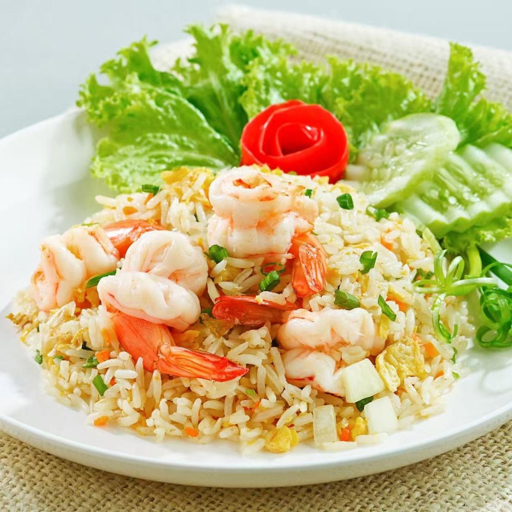 Mama-Hong’s-Pho-&-Bistro-Vietnamese-Restaurant-Shrimp-Fried-Rice-Mustang Flavorful shrimp fried rice garnished with lettuce at Mama Hong's Pho & Bistro, a Vietnamese Restaurant in Mustang.